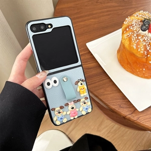 Detailed view of light blue leather foldable phone case with cute cartoon dog charms