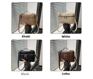 Detail view of four colors of pebbled leather square bags with dual zippers and top handles