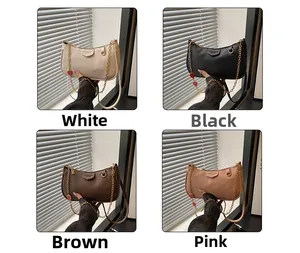 Detail of four color options for trendy shoulder bags with lychee pattern and heart charms