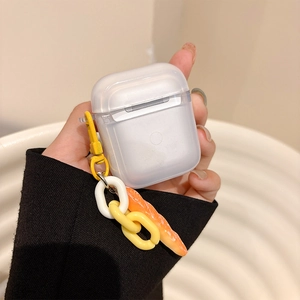 Detail of glitter silicone AirPods case with baguette bread charm and chain link strap