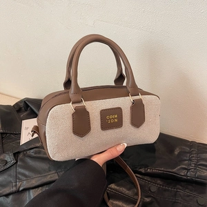 Retro canvas bowling bag with brown leather trim and shoulder strap for women
