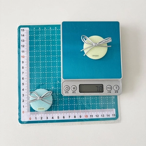 Detail shot showing 4cm diameter and 7.8g weight of glitter butterfly phone socket