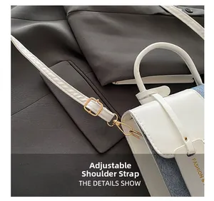 Detail of adjustable white strap with gold buckle on contrast color crossbody bag