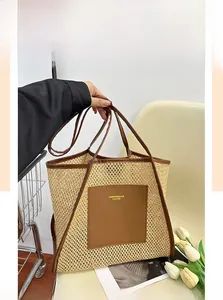 Detail of woven tote bag with brown leather trim and fashion text logo printing