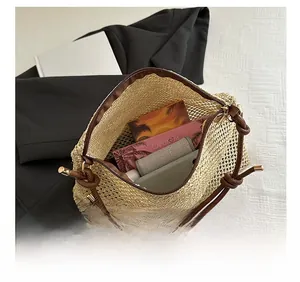Top view showing the internal capacity of a beige woven bag with cosmetics and phone