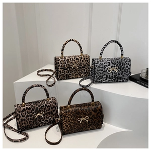 Detailed collection of leopard print crossbody bags with golden bow metal clasps