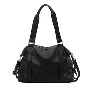 Large black pebbled leather tote bag with sturdy handles and adjustable crossbody strap