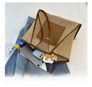 Detail showing high-capacity woven tote bag with brown leather handles and spacious interior