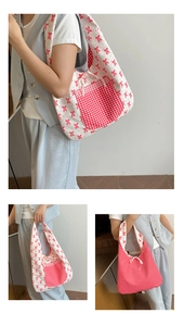 Detail of floral and red checkered reversible tote bag with lace pocket and ribbon bow tie
