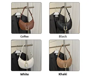 Detail of crescent shoulder bags in four colors with textured weave and gold buckle