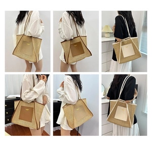 Close-up of woven straw tote bag with faux leather straps and rectangle patch detail