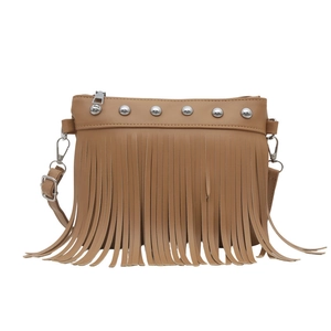 Brown tassel crossbody bag with silver studs and adjustable strap in bohemian style