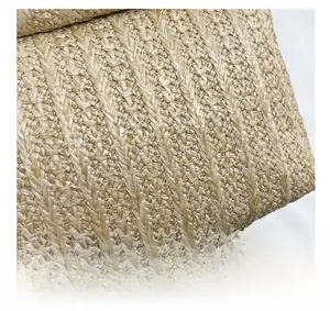 Macro view of beige straw weaving texture with V-shaped braided pattern details