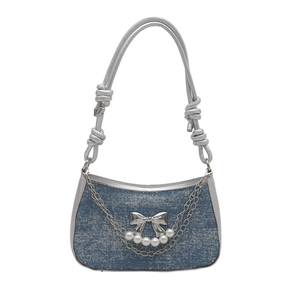 Blue denim crossbody bag with butterfly metal charm and pearl chain details