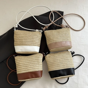 Handwoven bucket bag set in four colors with leather straps and contrast trim