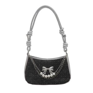 Chic black denim hobo bag with silver bow, chain detail and pearl accents