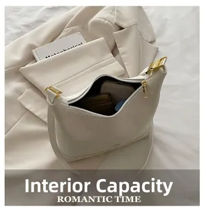 Interior view of off-white faux leather handbag showing large storage capacity for essentials