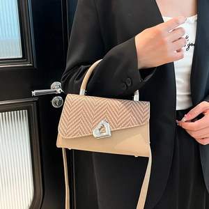 Retro patchwork crossbody bag with heart buckle and herringbone pattern flap