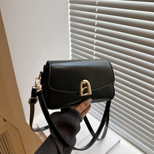 Minimalist black faux leather small square bag with golden arch buckle and shoulder strap
