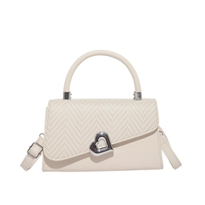Beige vintage top-handle bag with woven texture, heart twist lock and adjustable strap
