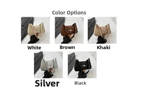 Detail shot of elegant baguette underarm bags with stylish star-shaped metal buckles