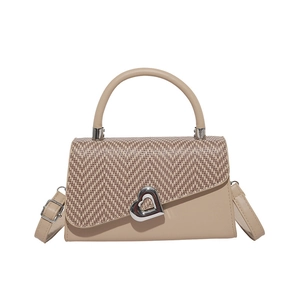 Vintage beige handbag with woven patchwork flap and heart-shaped silver metal buckle