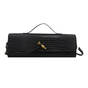 Elegant black crocodile pattern baguette bag with a unique gold metal buckle