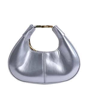 Minimalist silver crescent moon shoulder bag with smooth metallic finish and gold hardware