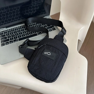 Chic black nylon crossbody chest bag with adjustable strap for urban commuting style