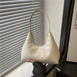 Minimalist ivory lizard-embossed hobo shoulder bag with a sleek half-moon silhouette