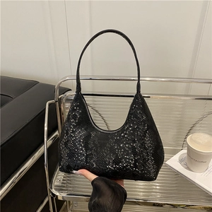 Minimalist black faux snake skin hobo shoulder bag with a stylish crescent shape