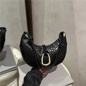 Chic black woven hobo shoulder bag with gold metal buckle and knotted strap detail