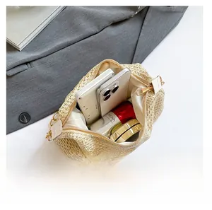 Interior view of hand-woven shoulder bag showing daily essentials and storage capacity