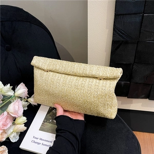 Minimalist straw woven clutch bag with gold ring buckle and beige raffia folding cover
