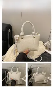 Close-up of white snake pattern leather texture with gold Fashion lettering and metal handle