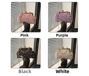 Detail of beaded evening clutches in pink, purple, black and white with sequins