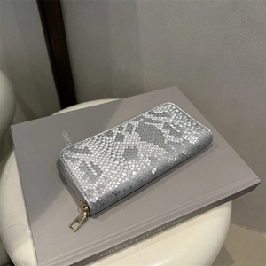Silver snakeskin textured long wallet with golden zipper for women in minimalist style