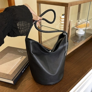 Fashion black lychee grain leather bucket bag with wide strap and gold chain detail