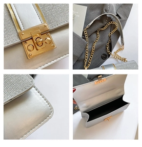 Detail view of silver chain bag featuring gold hardware lock and fine stitching texture