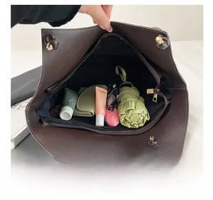 Top view of deep brown pebbled leather tote bag showing large capacity for daily items