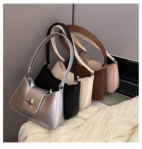 Group shot of trapezoidal shoulder bags in five colors with star-shaped metal buckles