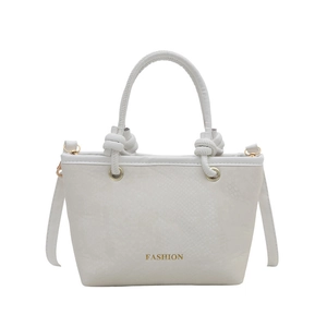 Minimalist woven handbag in off-white faux snake skin with gold fashion lettering