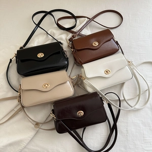 Minimalist faux leather crossbody bags with gold rotary clasps in five stylish colors