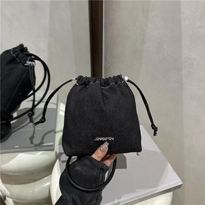 Fashionable black denim drawstring bucket bag with JINGPIN metal logo and crossbody strap