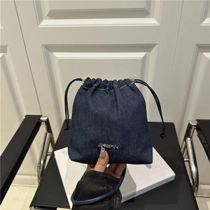 Fashionable dark blue denim drawstring bucket bag with silver metal logo and handle