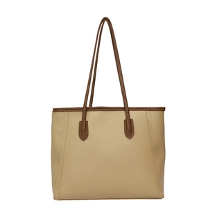 Beige and brown leather tote bag with contrast handles for elegant office commuting