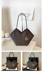 Detail view of coffee-colored tote with M-letter pattern, V-neck opening and metal charm