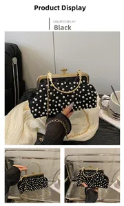 Detail of elegant black lace handbag with white pearls and gold chain strap