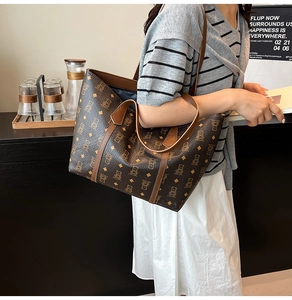 Detail of vintage brown tote bag with bear pattern worn by a model in lifestyle setting