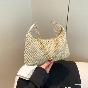 Beige woven straw tote bag with gold chain strap for summer beach shoulder wear